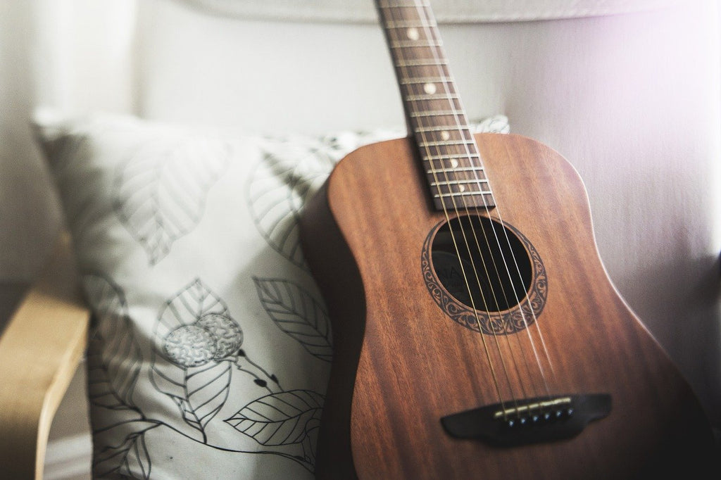 Guitar Leaning on a Pillow