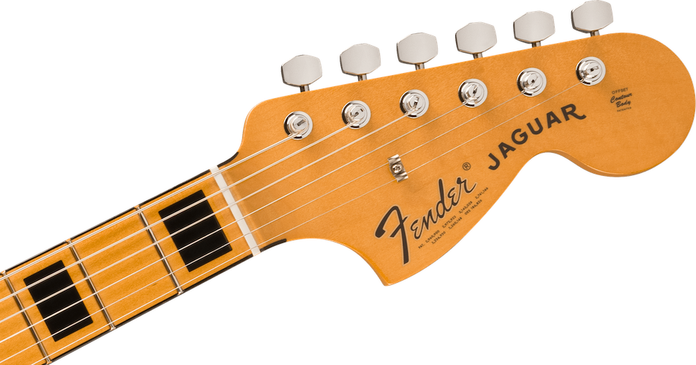 Close-up of a Fender electric guitar headstock with tuning pegs and brand name.
