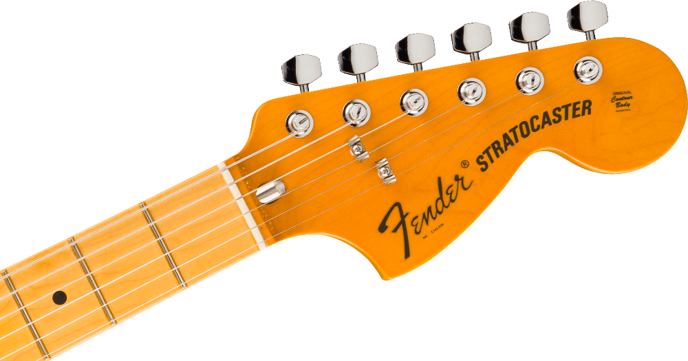 Close-up of a Fender Stratocaster guitar headstock on a green background