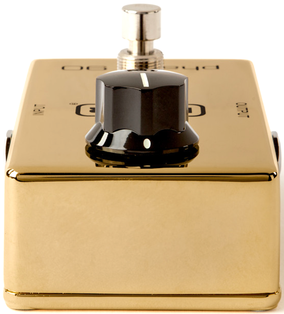 Gold and black bathroom fixture with pump on a white background