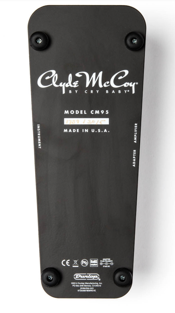 Back view of a Clyde McCoy toy with branding and model information on a white background