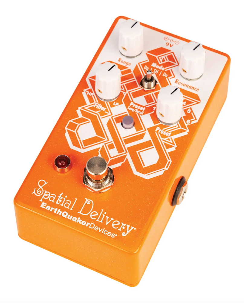 An orange effects pedal with knobs and switches labeled 'Spatial Delivery' from EarthQuaker Devices, EarthQuaker Devices Spatial Delivery V3 Envelope Filter Effects Pedal at Twin Town Guitars in Minneapolis Minnesota