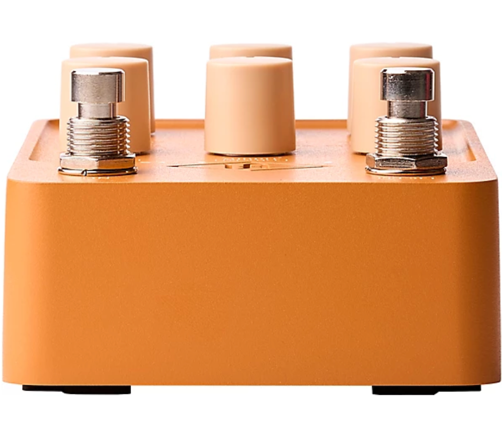 Orange electronic device with cylindrical components on a white background