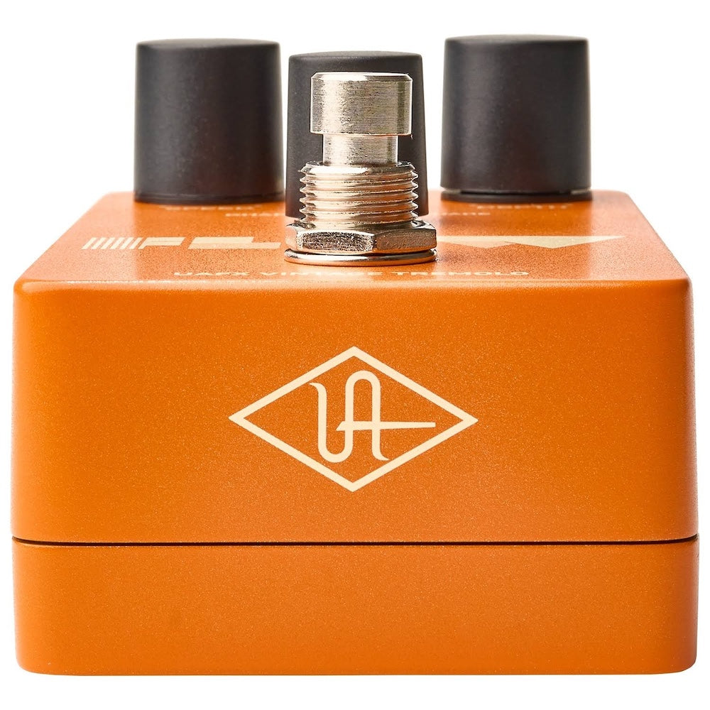 Orange electronic pedal with three knobs on a white background
