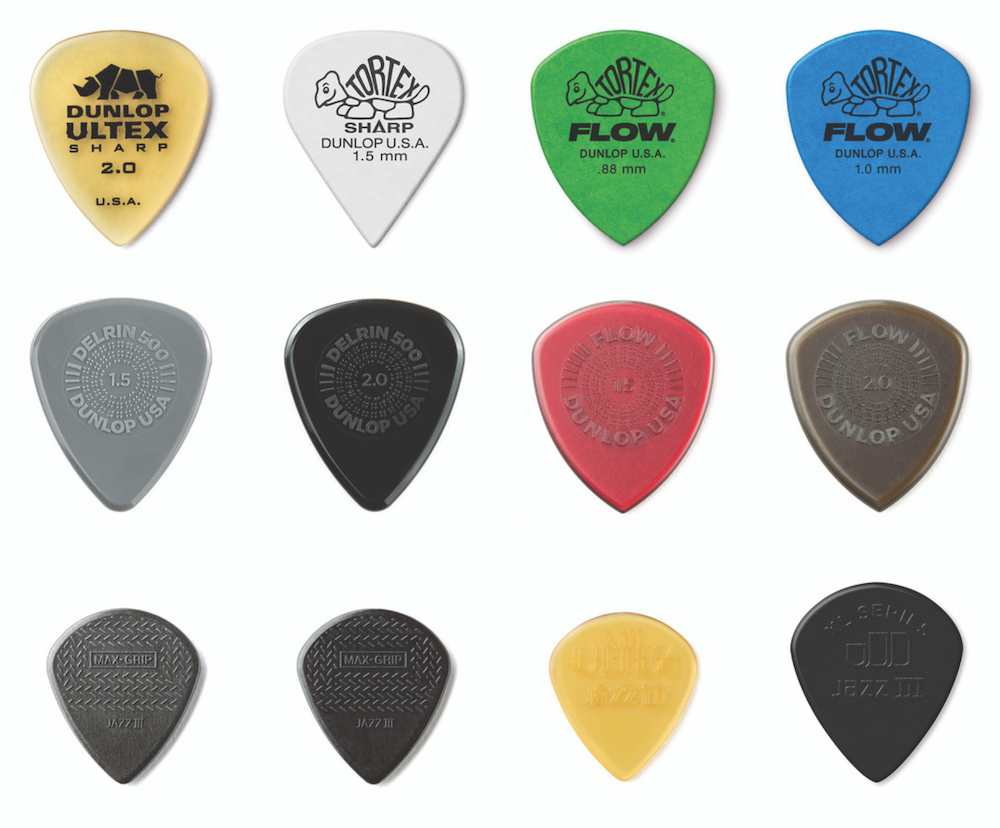 Collection of Dunlop guitar picks in various colors and sizes on a white background