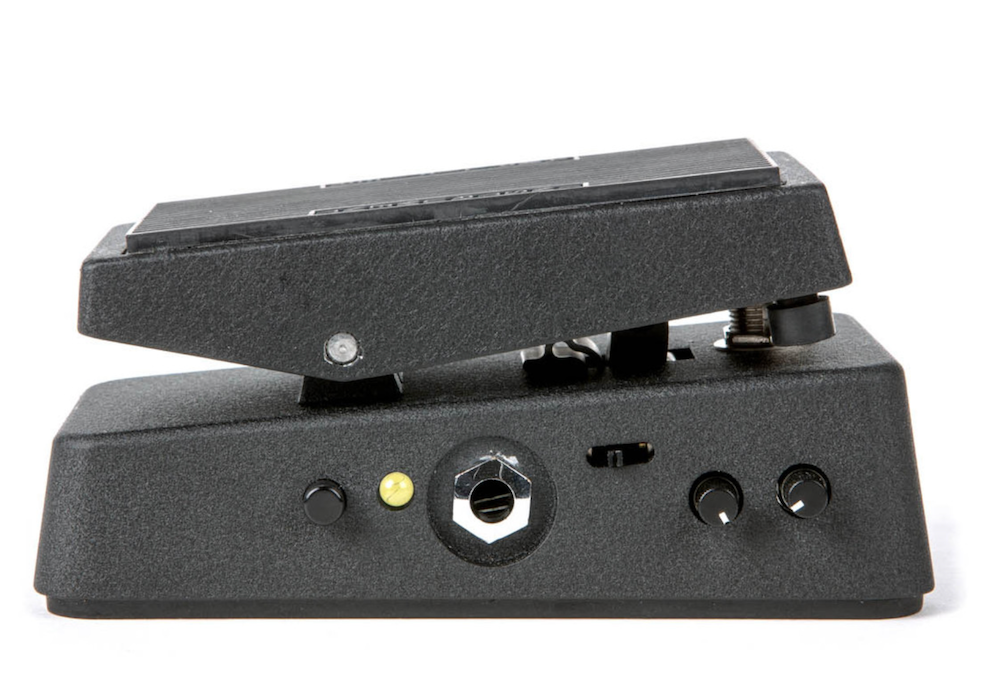 Black guitar pedal with various controls on a white background